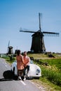 Schermerhorn Alkmaar Netherlands April 2020,. couple doing a road trip with a old vintage sport car White Porsche 356 Speedster, Royalty Free Stock Photo