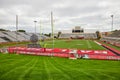 Scheumann Stadium lush green grass, empty stadium seating, and yellow goal post on football field