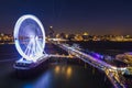 Scheveningen, the Hague illuminated ferris wheel on the pier at night under moonlight Royalty Free Stock Photo