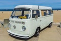 Cream classic VW kombi van at the beach Royalty Free Stock Photo