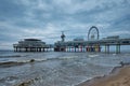 The Scheveningen Pier Strandweg beach in The Hague with Ferris wheel. The Hague, Netherlands