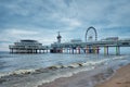 The Scheveningen Pier Strandweg beach in The Hague with Ferris wheel. The Hague, Netherlands Royalty Free Stock Photo