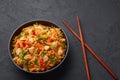 Schezwan Chicken Fried Rice in black bowl at dark slate background. indo-chinese cuisine dish Royalty Free Stock Photo