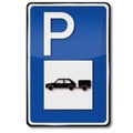 Blue shield parking for cars with trailer Royalty Free Stock Photo