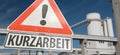 Warning sign with the german word `Kurzarbeit` short-time work Royalty Free Stock Photo