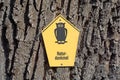 German sign `Naturdenkmal` natural monument on tree trunk Royalty Free Stock Photo