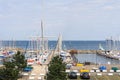 View of sailboats docked at the pier in summer with clouds in blue sky background Royalty Free Stock Photo