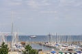 View sailboats docked at the pier viewed from University of Kiel Sailing Center in summer with clouds in blue sky background Royalty Free Stock Photo