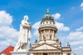 Schiller monument and French Church dome on Gendarmenmarkt square, Berlin, Germany Royalty Free Stock Photo