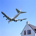 Schiphol runway approach by plane low over houses