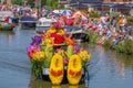 Colorful dancing girls on a beautiful decorated boat waving to t