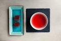 Schizandra tea and fruits marmalade, top view. Traditional ancient Korean drink is brewed from Chinese lemongrass berries. Used