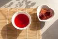 Schizandra tea is a traditional Korean drink. It is brewed from Chinese schisandra berries used in herbal medicine. Nearby are