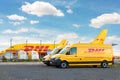 Schkeuditz, Germany - 29th May, 2022 - Many courier van against cargo planes parked on Leipzig Halle airport terminal Royalty Free Stock Photo