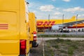 Schkeuditz, Germany - 29th May, 2022 - Many courier van against cargo planes parked on Leipzig Halle airport terminal Royalty Free Stock Photo