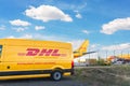 Schkeuditz, Germany - 29th May, 2022 - Many courier van against cargo planes parked on Leipzig Halle airport terminal Royalty Free Stock Photo