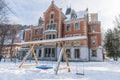 Schladming Town Hall in winter, snow covered park, in the centre of the city. Schladming is popular ski resort in Austria Royalty Free Stock Photo