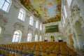 Schleissheim, Germany - July 30, 2015: Room full of chairs with absolutely incredible fresco painting in ceiling, walls