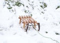 Schlitten Holz. Wooden vintage winter sled in the snow Royalty Free Stock Photo