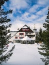 Schlosshotel Seewirt at Turracher HÃÂ¶he, Carinthia, Austria, during winter, deep snow, icicles, Christmas holiday Royalty Free Stock Photo