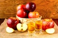 Schnapps drinks and apples in the wicker basket Royalty Free Stock Photo