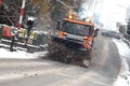 Snow removal winter service with a truck in the Salzkammergut