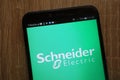 Schneider Electric logo displayed on a modern smartphone