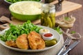 Schnitzel with mashed potatoes and salad