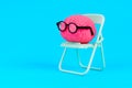 Scholarly Mind: Brain in Glasses on Green Folding Chair