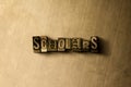 SCHOLARS - close-up of grungy vintage typeset word on metal backdrop