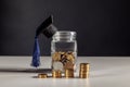 Scholarship money concept. Coins in jar with money stack step growing growth