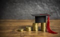 Scholarships education concept with graduation cap on coin money saving  for grants education Royalty Free Stock Photo