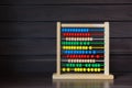 School Abacus with Colorful Beads on Wood Background, Kids Learning Equipment, Mathematics Class Stationary Concept