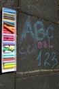 School, ABC and 123 sigh written with colored chalks on a pavement. Drawing Back to school on an asphalt. and vacation concept Royalty Free Stock Photo