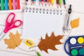 School accessories and orange leaves on white boards, back to school concept Royalty Free Stock Photo