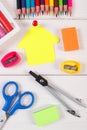 School accessories and shape of building on white boards, back to school concept Royalty Free Stock Photo