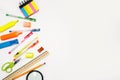 School accessories on a white background. stationery. back to school. concept of education. desk. color pens, pencils, ruler, alar