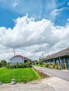 a school across from the rice fields. beautiful blue sky Royalty Free Stock Photo