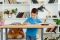 A school-age boy does homework at home. Training at school Royalty Free Stock Photo