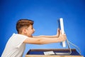 School-age boy sitting in front of the monitor laptop at studio Royalty Free Stock Photo