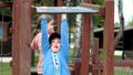 School age children two girls playing around on the playground, climbing, kids and fun physical exercise outdoors, sisters, Royalty Free Stock Photo