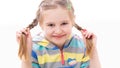 School age girl playing with her braided pigtail haircut