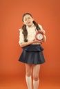 School alarm. Happy girl hold alarm clock counting for lunch time. School time. time to go to school. Children education Royalty Free Stock Photo
