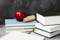 School attributes - books, colored pencils, notebook, apple on Royalty Free Stock Photo