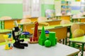 School background with educational accessories on the table