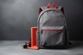 School backpack with books and pencils on table against blackboard background, Backpack with school supplies on a gray background Royalty Free Stock Photo