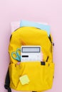 School backpack with educational supplies. Royalty Free Stock Photo