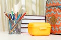 School backpack with school supplies. Books, stand for pencils w