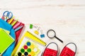 School backpack with stationery on white background. Royalty Free Stock Photo