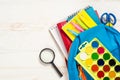 School backpack with stationery on white background. Royalty Free Stock Photo